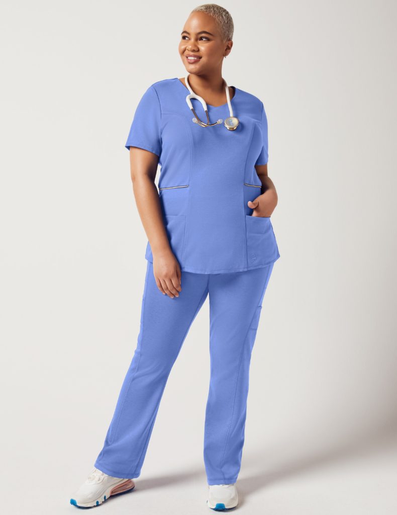Nurse wearing zipper waist top light blue scrubs