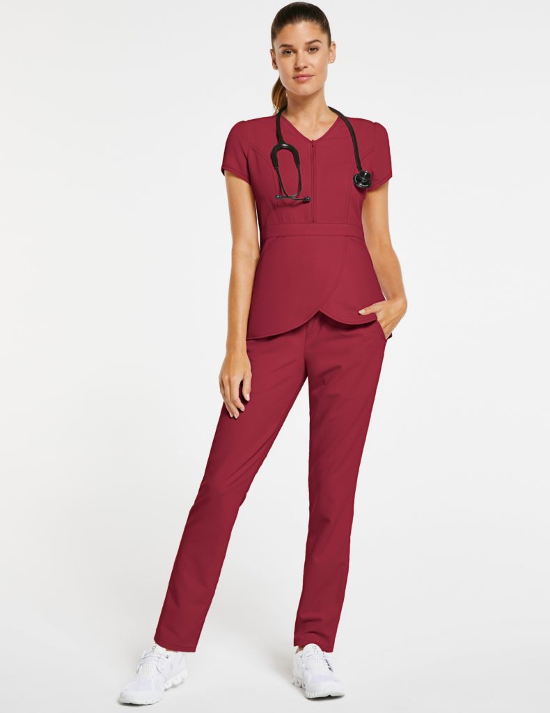 Nurse wearing relaxed burgundy pant jaanuu scrubs