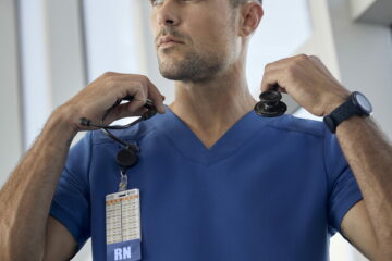 Male-nurse-wearing-blue-scrub-and-stethoscope