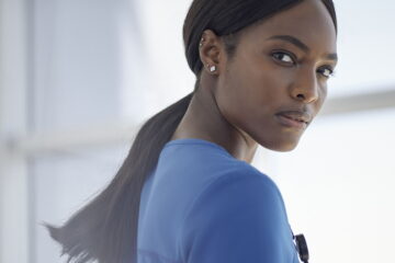 black-female-health-professional-wearing-blue-scrub-top