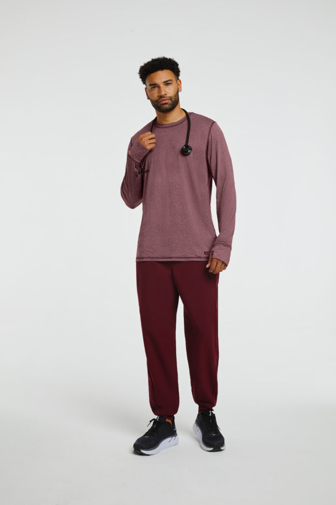 Male medicine student wearing comfy burgundy top and pants