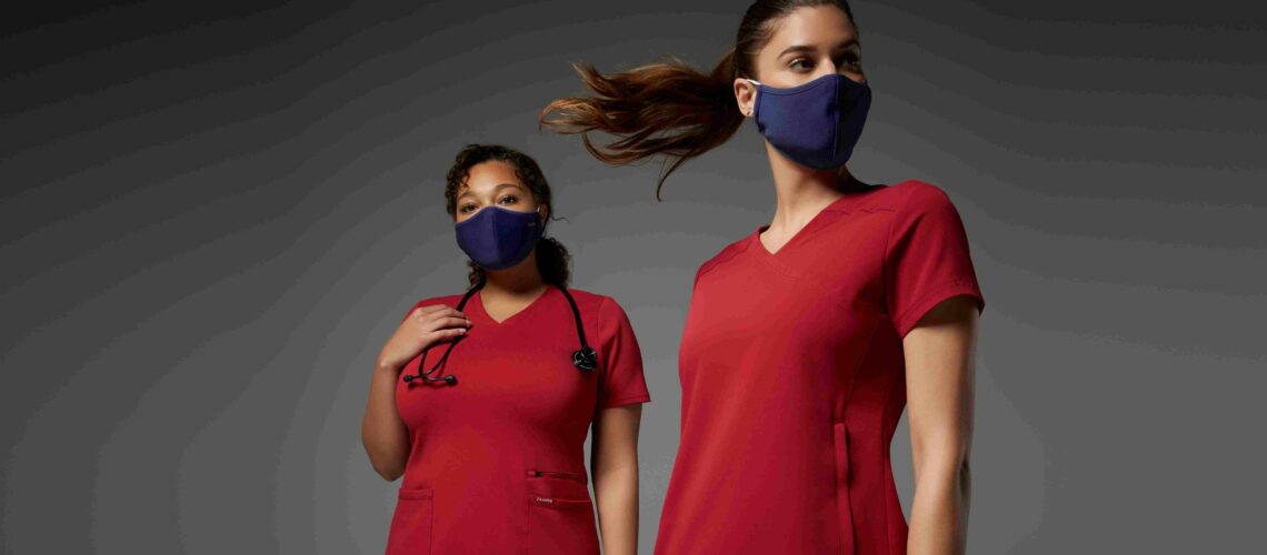 two-nurses-wearing-masks-and-red-uniforms
