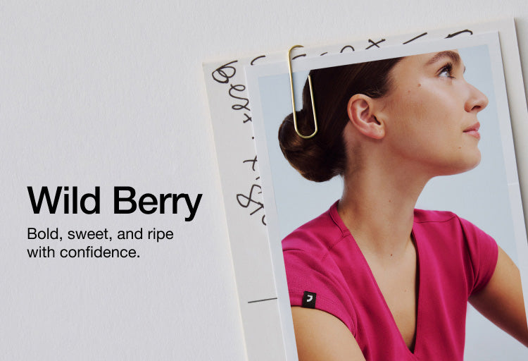 Image of a woman wearing JAANUU Wild Berry scrubs. Image has text, "Wild Berry: Bold, sweet, and ripe with confidence."