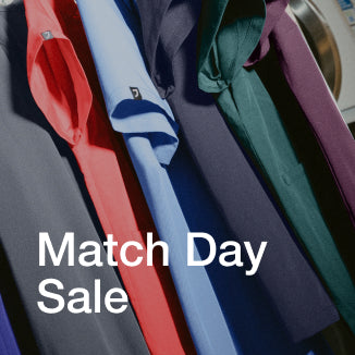 An assortment of Jaanuu scrubs in different colors. - Women Nav Tile