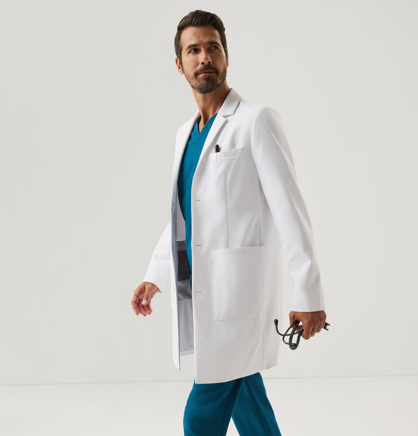 Man wearing white Jaanuu lab coat.