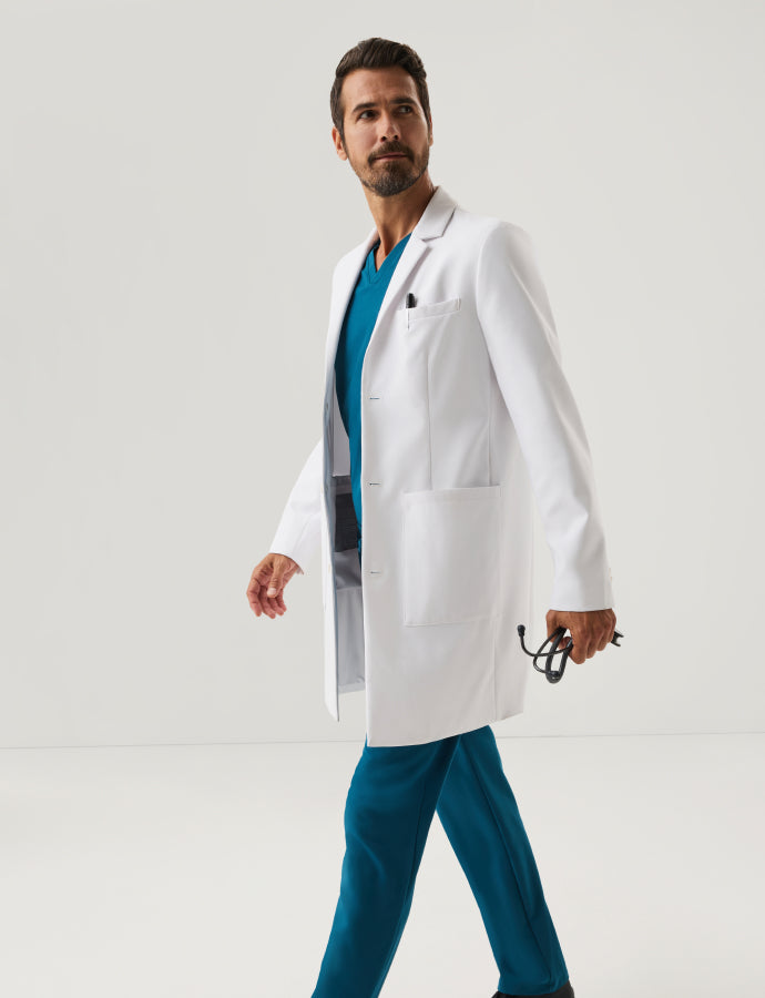 Man wearing white Jaanuu lab coat.