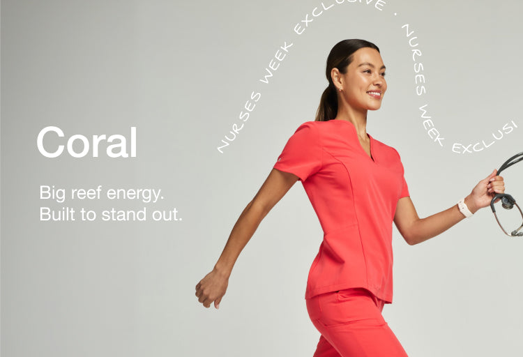 Woman wearing a coral Jaanuu scrub top, smiling and looking down, with inset of her walking in full coral scrubs, with text 'Coral' and 'Big reef energy. Built to stand out.'