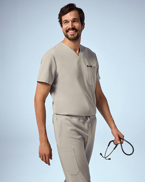 Man wearing Fog color scrubs. - Men Nav Tile