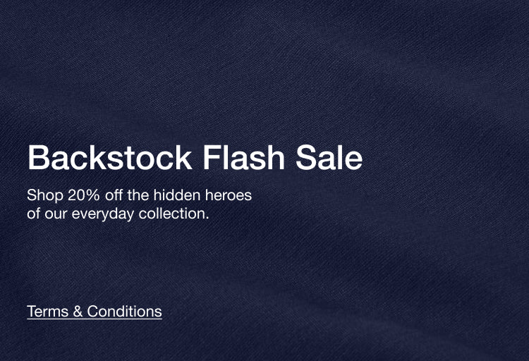Promotional text for a flash sale on scrubs with a midnight navy background: Backstock Flash Sale. Shop 20% off the hidden heros of our everyday collection.