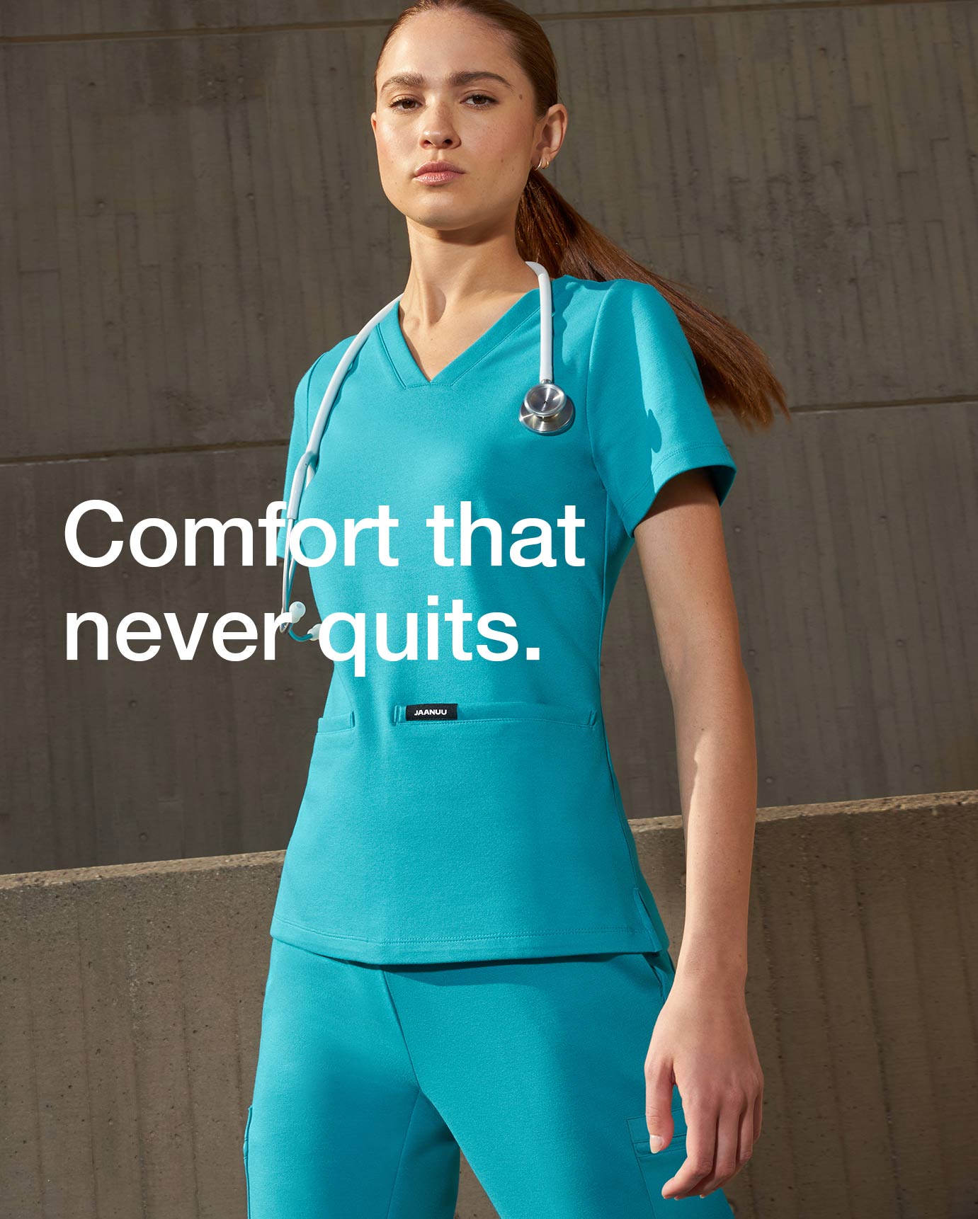 Woman wearing Teal color scrubs with text on image, "Comfort that never quits."