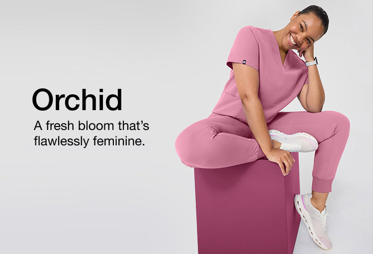 Image with text, "Orchid: A fresh bloom that's flawlessly feminine. " and an image of women wearing Orchid color scrubs.