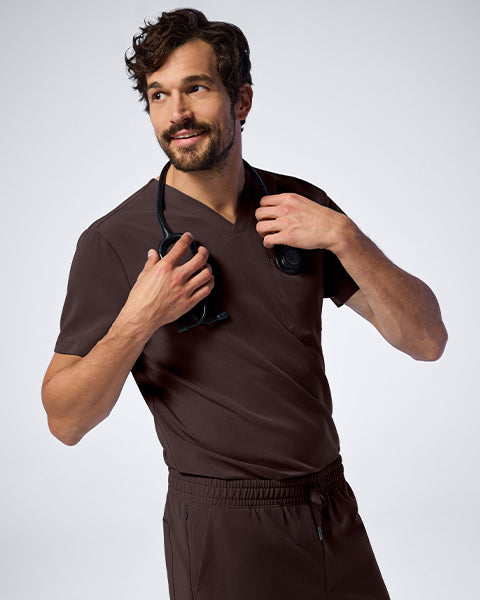 Man wearing Espresso colored scrubs. - Men Nav Tile