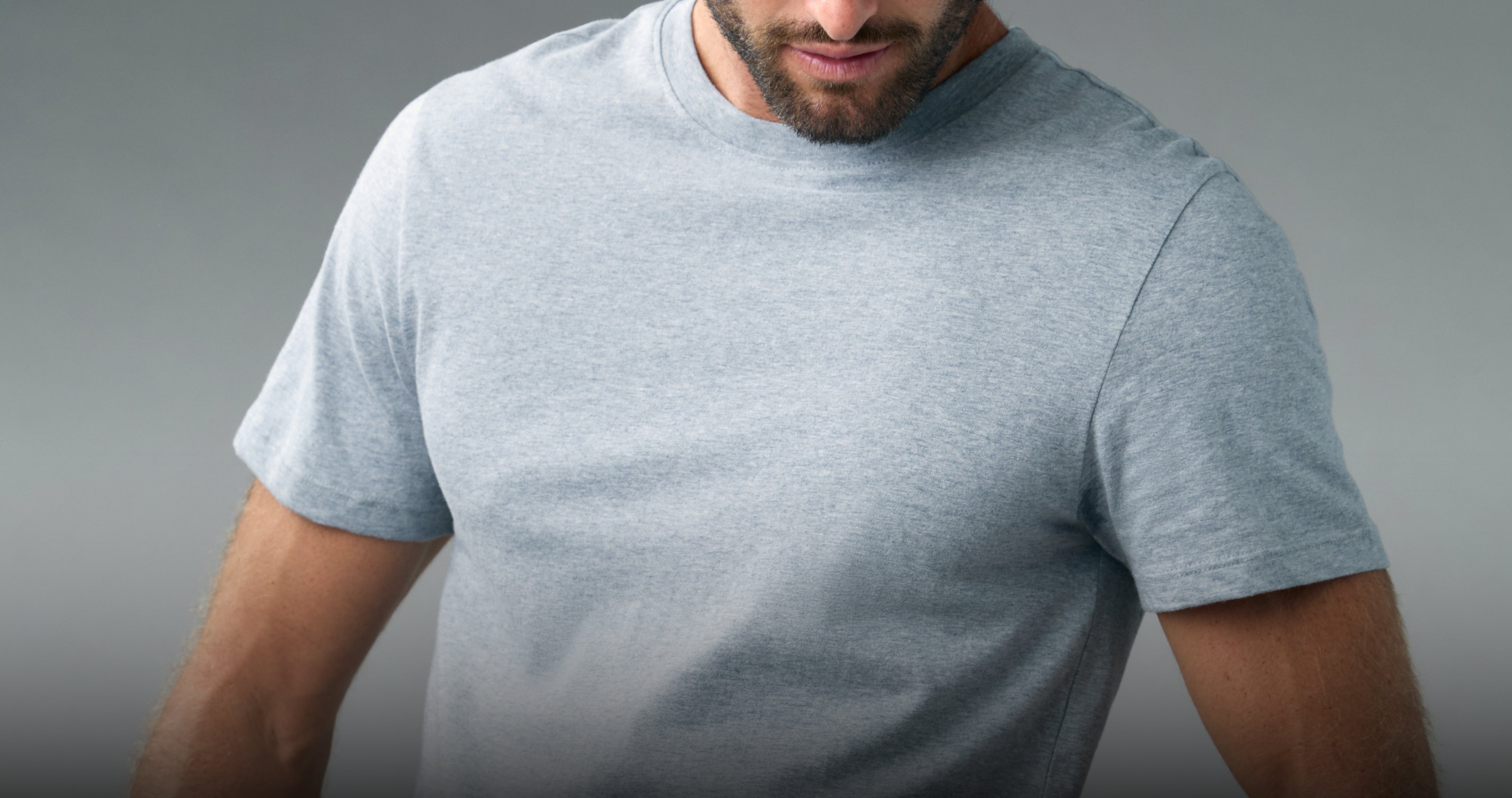 Man in a gray heather ROC® Cotton underscrub T-shirt