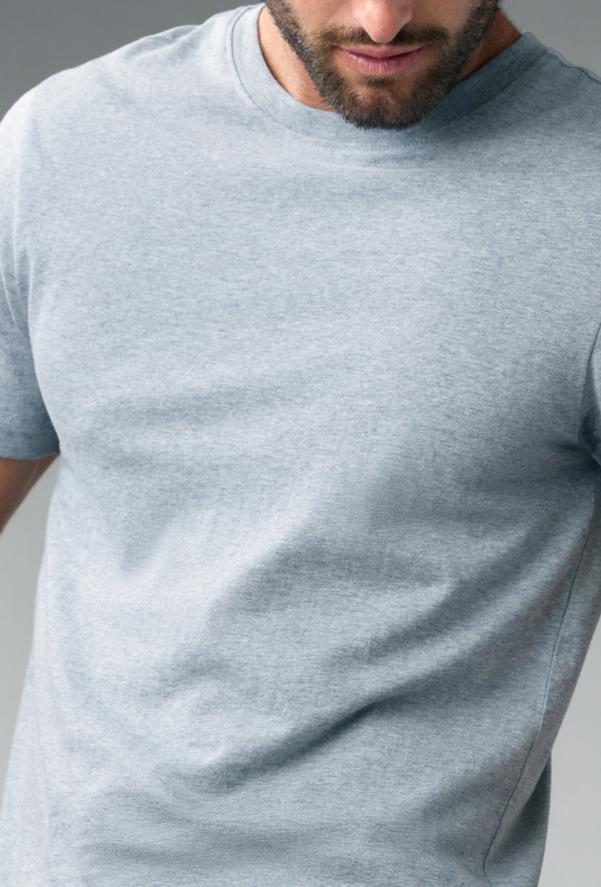 Man in a gray heather ROC® Cotton underscrub T-shirt