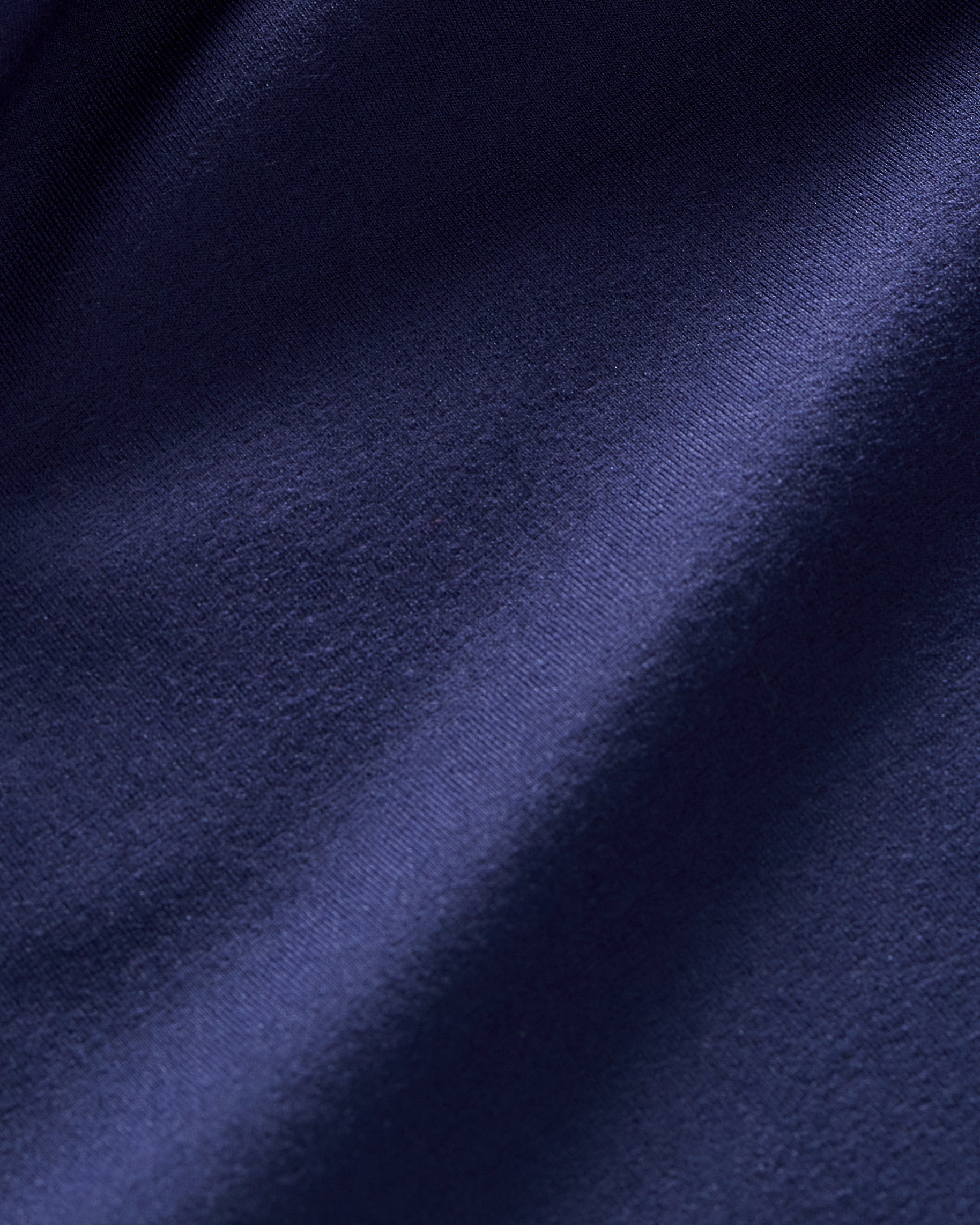 Close-up of soft navy knit scrub fabric