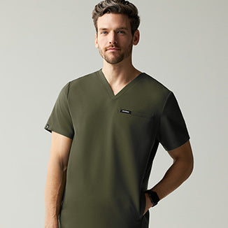 Man wearing Deep Olive colored scrubs. - Men Nav Tile