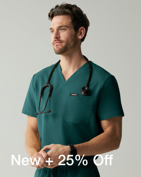 A man wearing Midnight Green scrubs. - Men Nav Tile