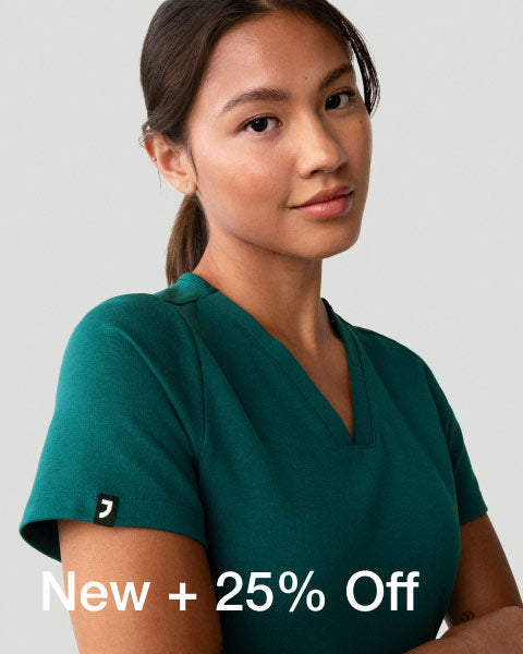 3 women wearing scrubs from the All-Hours capsule sitting at a table outdoors. - Women Nav Tile
