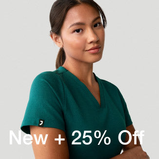 3 women wearing scrubs from the All-Hours capsule sitting at a table outdoors. - Women Nav Tile