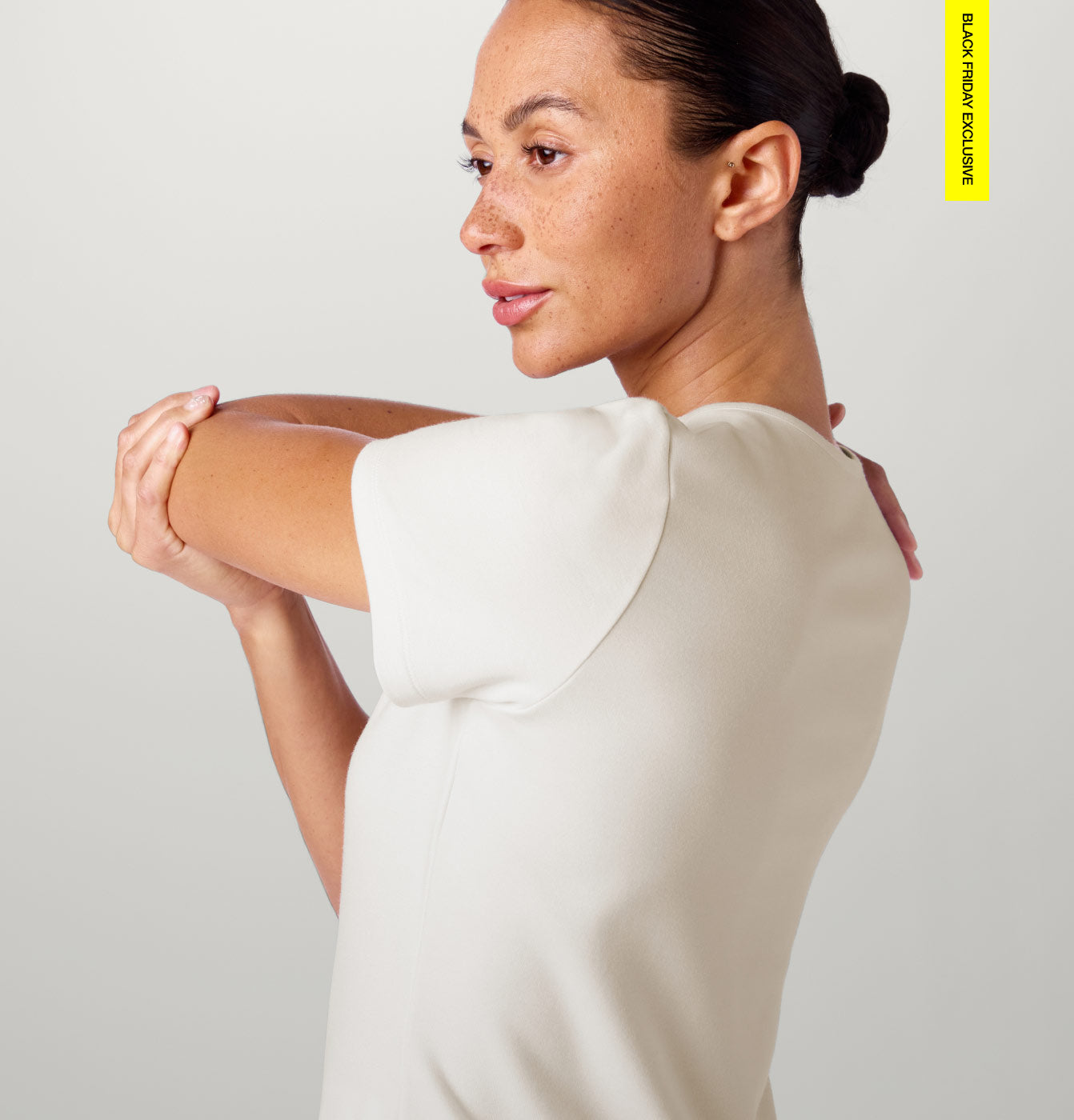 Woman wearing Frost color scrubs. Image has text, "Black Friday Exclusive" in the top right corner.