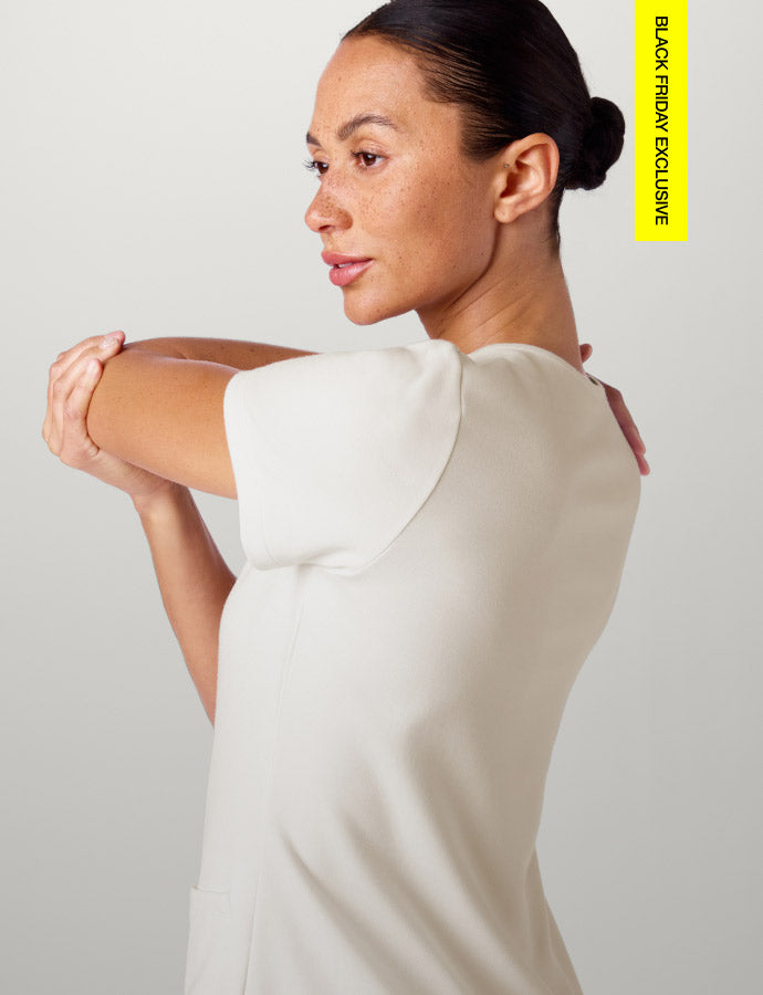 Woman wearing Frost color scrubs. Image has text, "Black Friday Exclusive" in the top right corner.