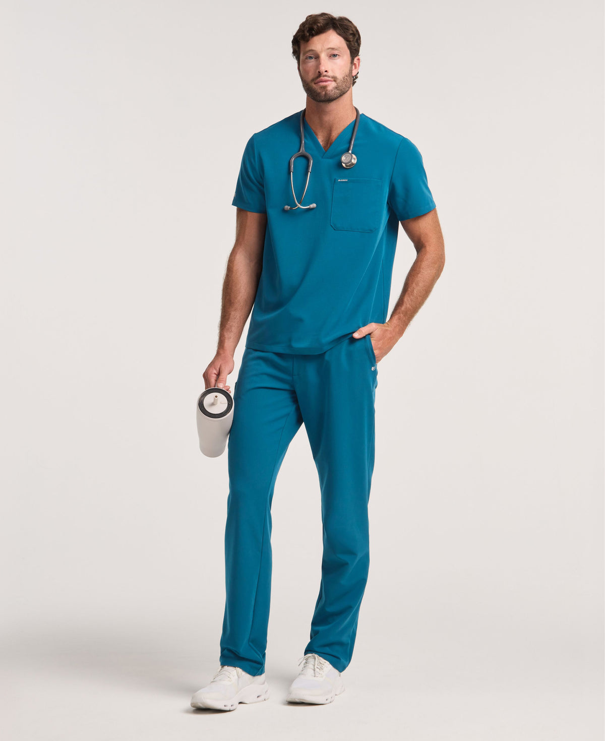 Jaanuu Holmes 1-Pocket Scrub Top in Caribbean Blue, product photo 2 of 6