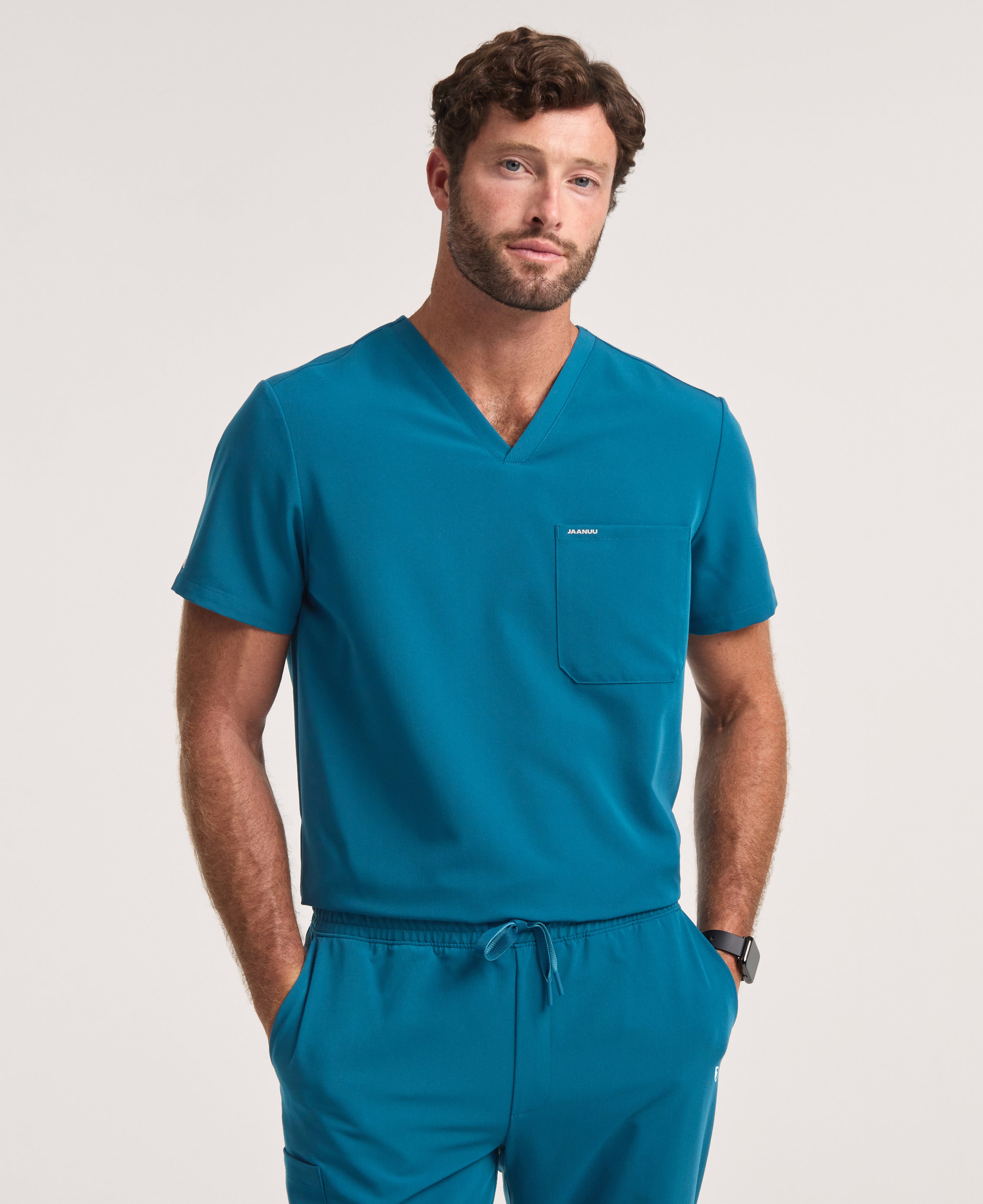 Jaanuu Holmes 1-Pocket Scrub Top in Caribbean Blue, product photo 3 of 6