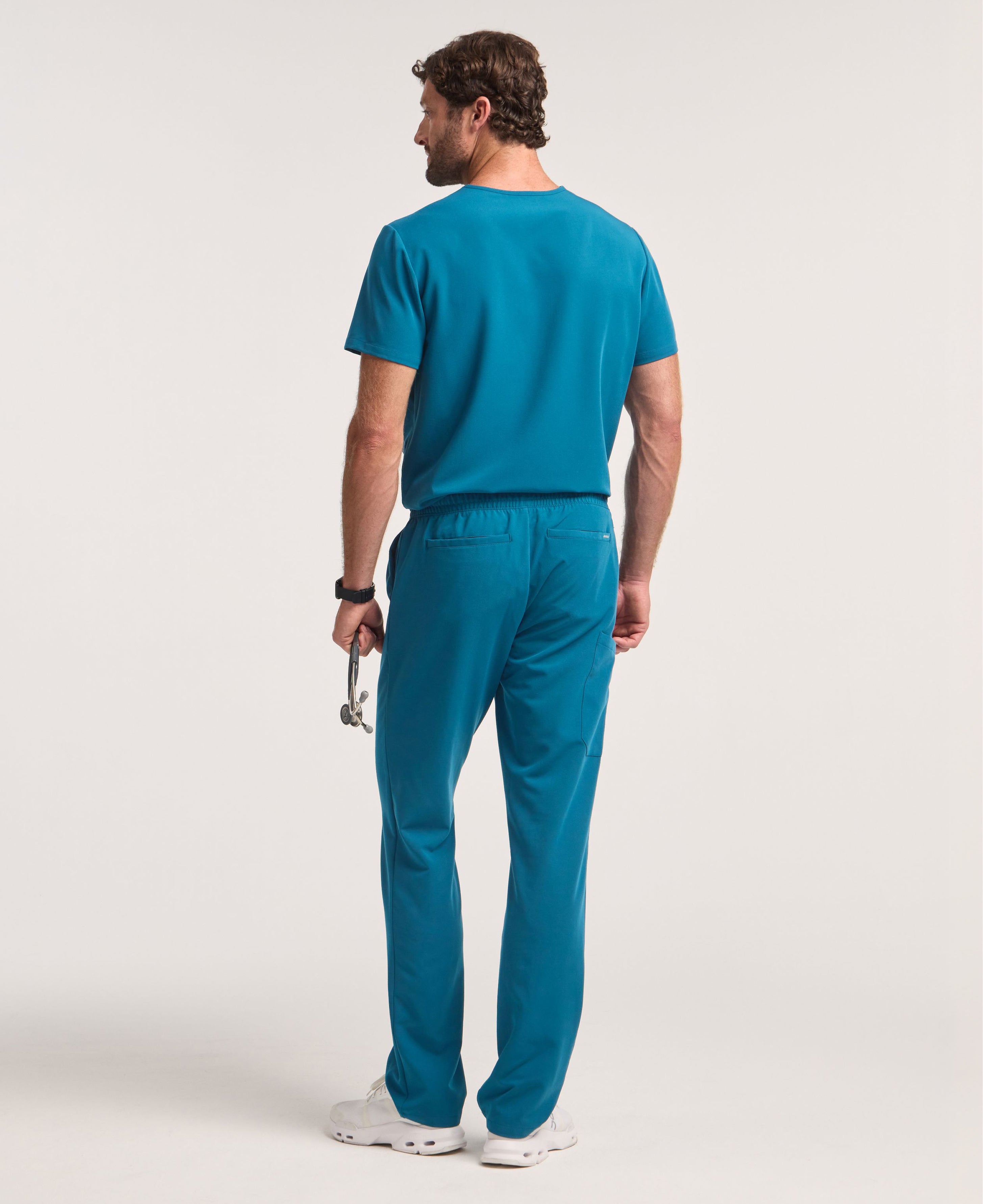 Jaanuu Holmes 1-Pocket Scrub Top in Caribbean Blue, product photo 6 of 6