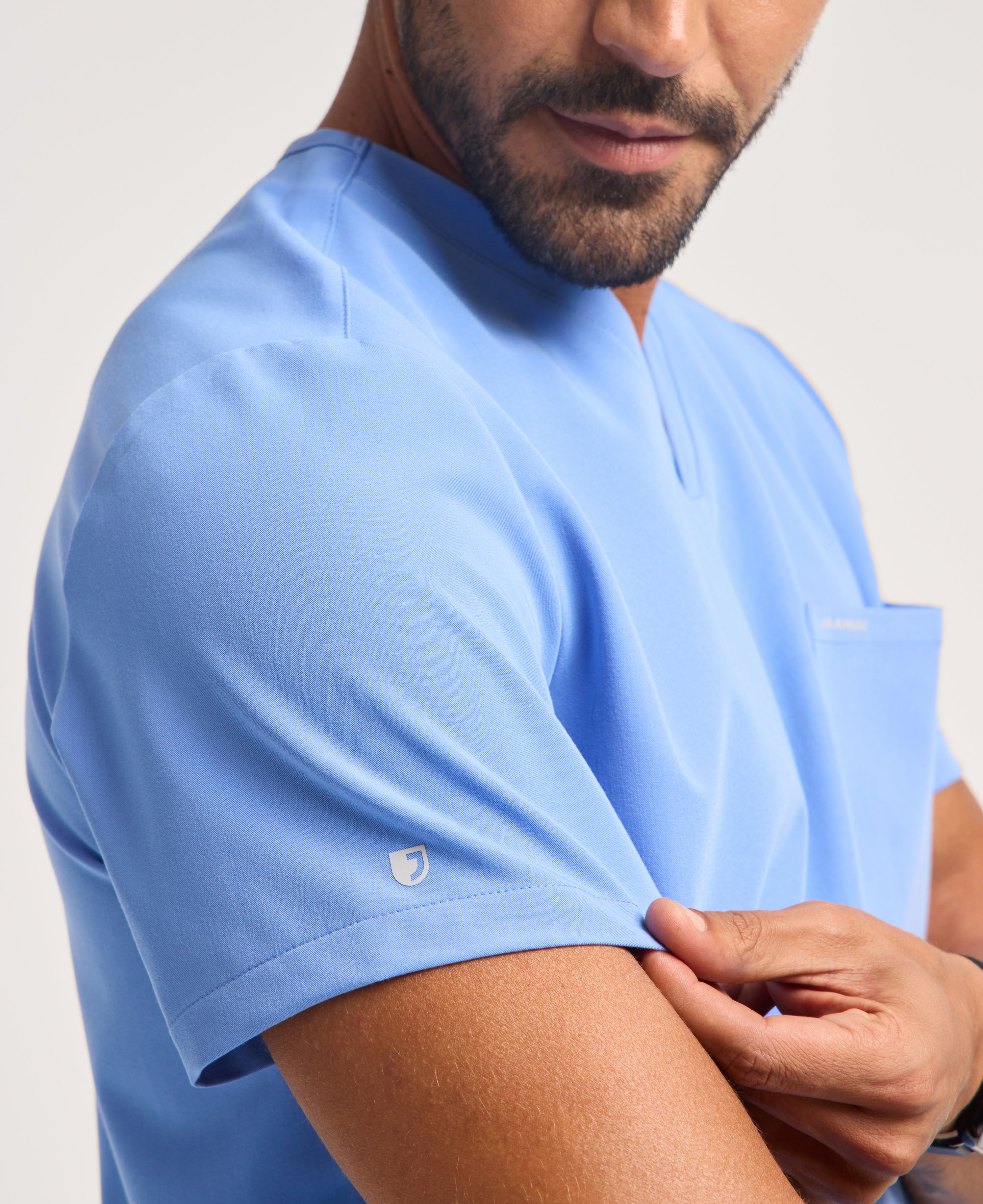 Jaanuu Holmes 1-Pocket Scrub Top in Ceil Blue, product photo 3 of 6