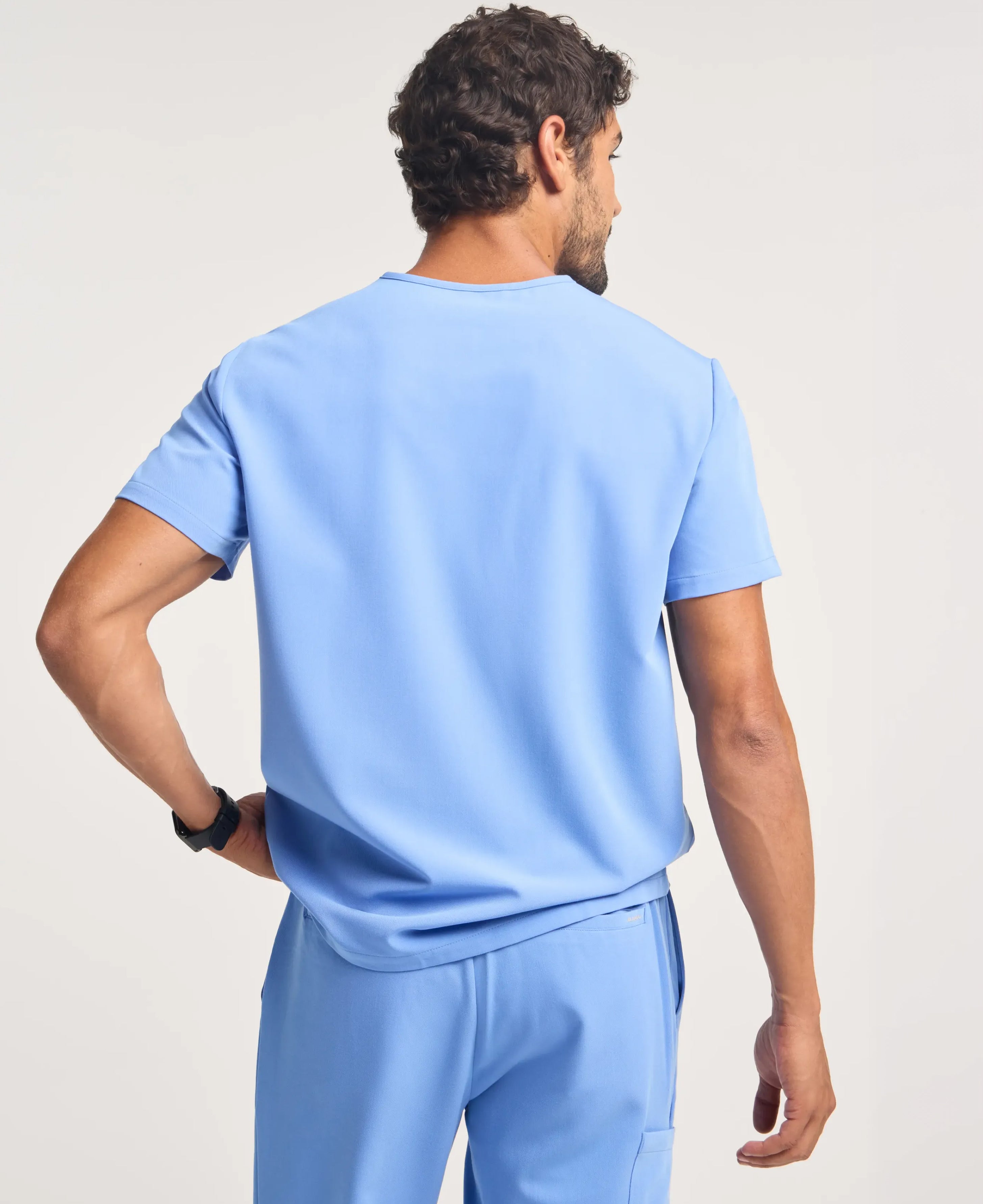 Jaanuu Holmes 1-Pocket Scrub Top in Ceil Blue, product photo 6 of 6