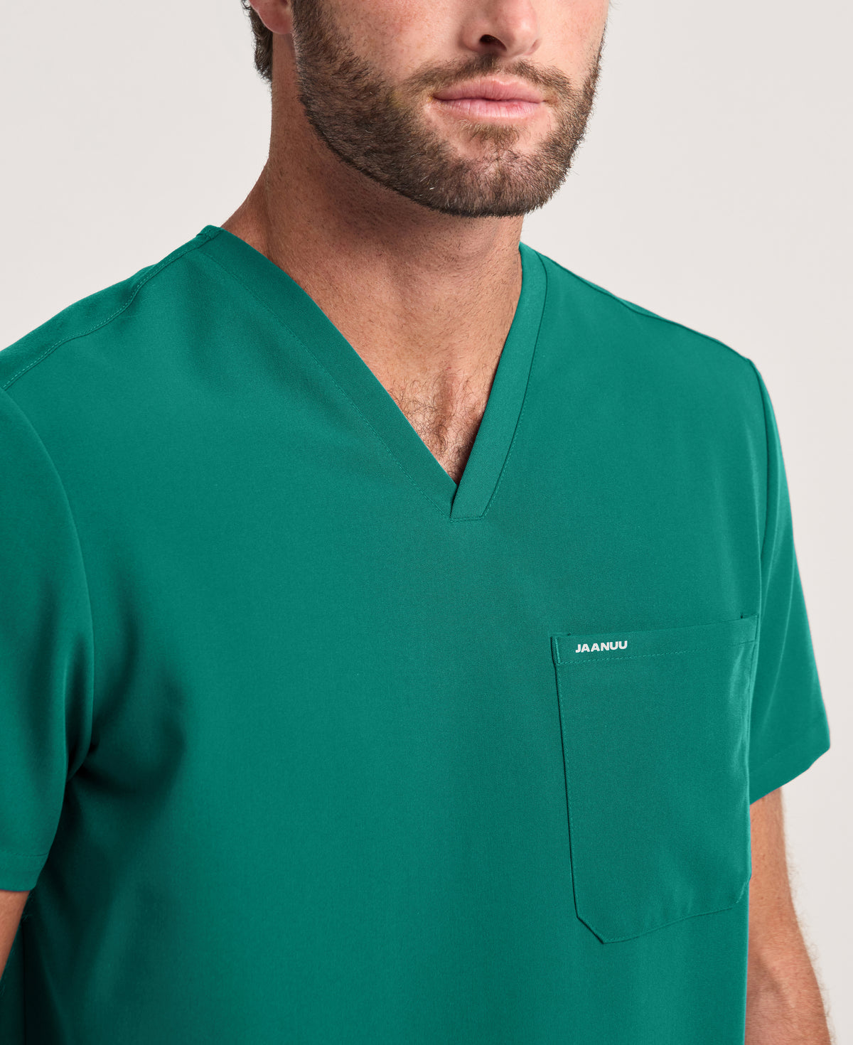 Jaanuu Holmes 1-Pocket Scrub Top in Hunter Green, product photo 3 of 6