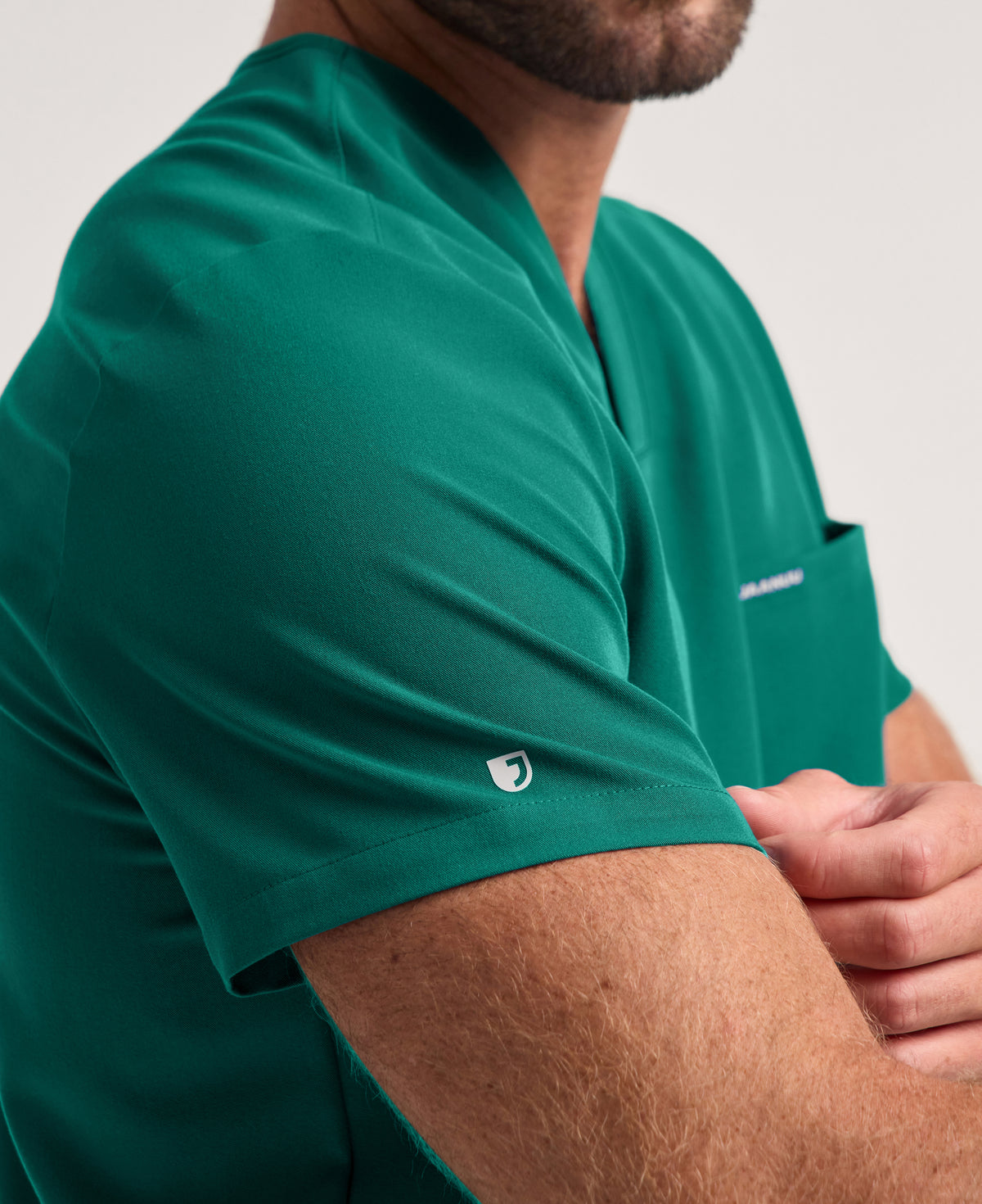 Jaanuu Holmes 1-Pocket Scrub Top in Hunter Green, product photo 5 of 6