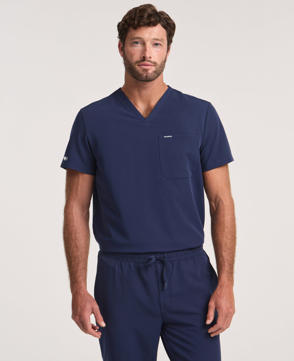 Jaanuu Holmes 1-Pocket Scrub Top in Midnight Navy, product photo 1 of 6