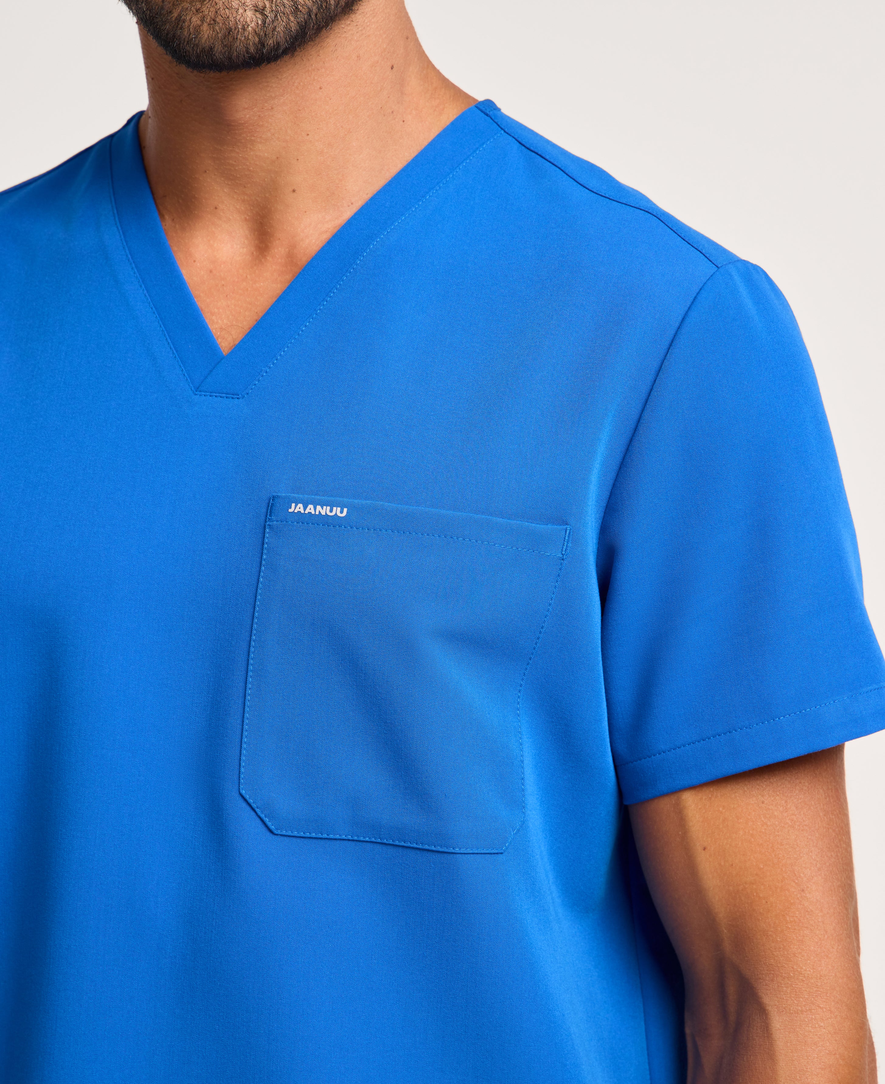 Jaanuu Holmes 1-Pocket Scrub Top in Royal Blue, product photo 5 of 6