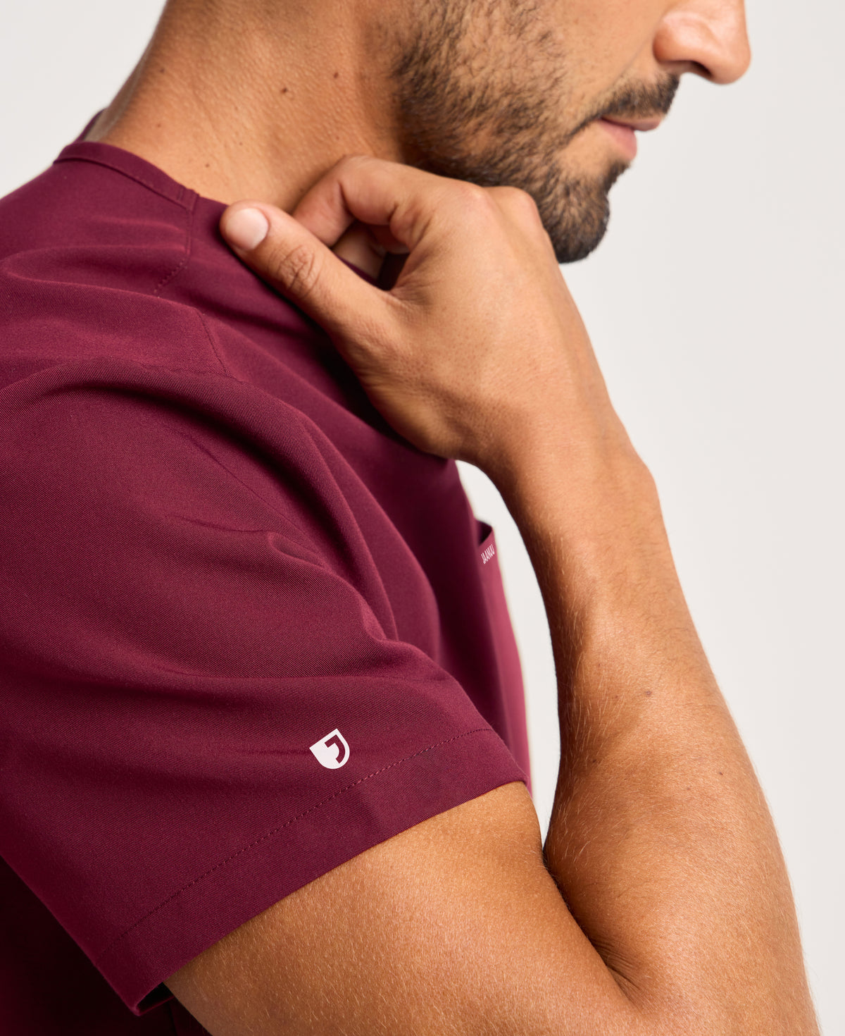 Jaanuu Platt 3-Pocket Scrub Top in Burgundy, product photo 5 of 6
