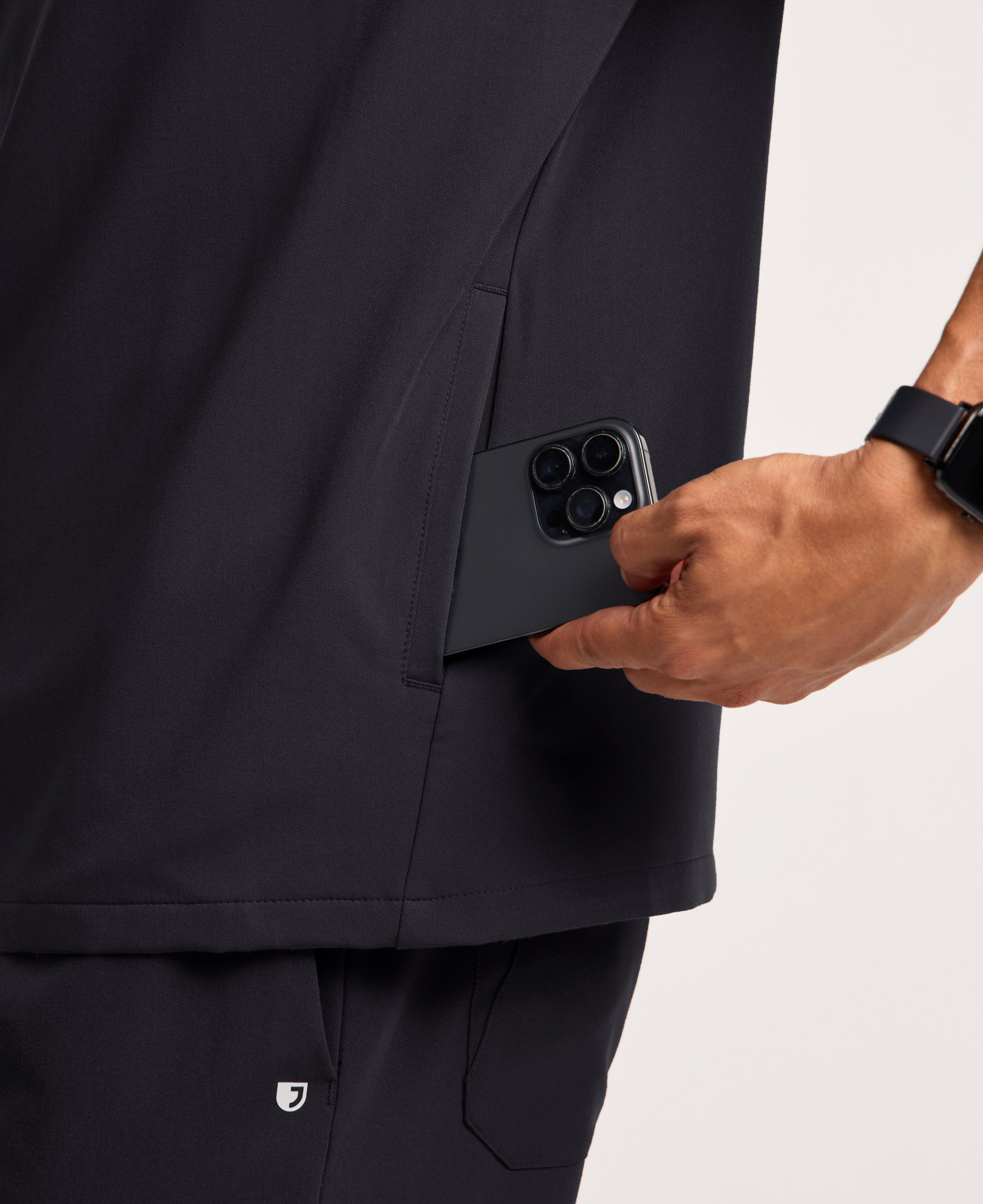 Jaanuu Platt 3-Pocket Scrub Top in Black, product photo 6 of 6