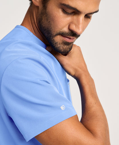Jaanuu Platt 3-Pocket Scrub Top in Ceil Blue, product photo 3 of 6