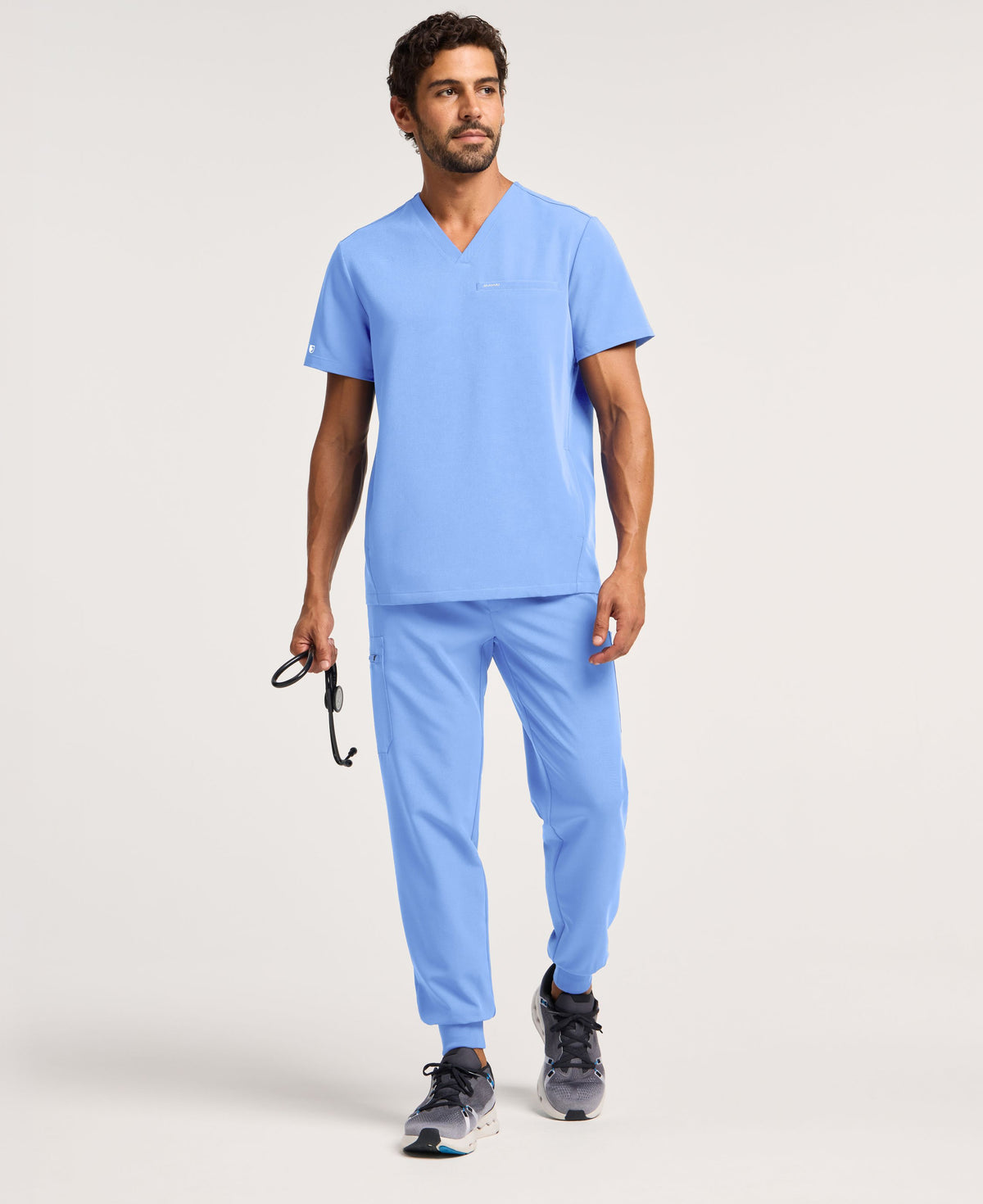 Jaanuu Platt 3-Pocket Scrub Top in Ceil Blue, product photo 4 of 6