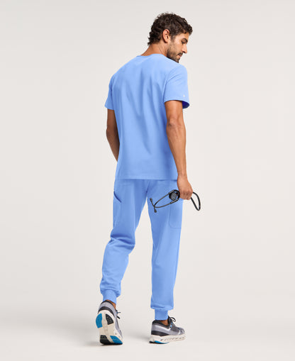 Jaanuu Platt 3-Pocket Scrub Top in Ceil Blue, product photo 5 of 6