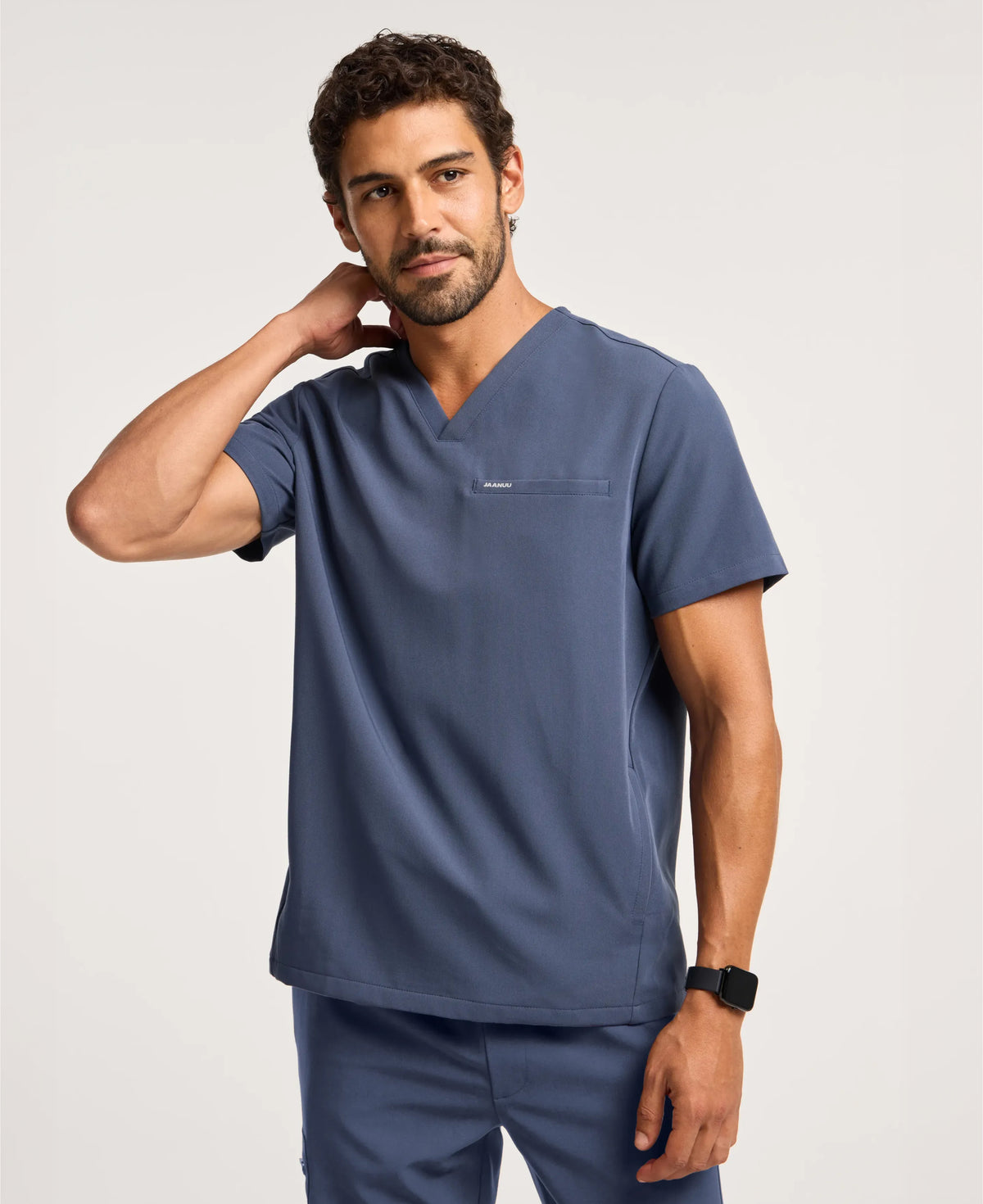 Jaanuu Platt 3-Pocket Scrub Top in Carbon Gray, product photo 1 of 6