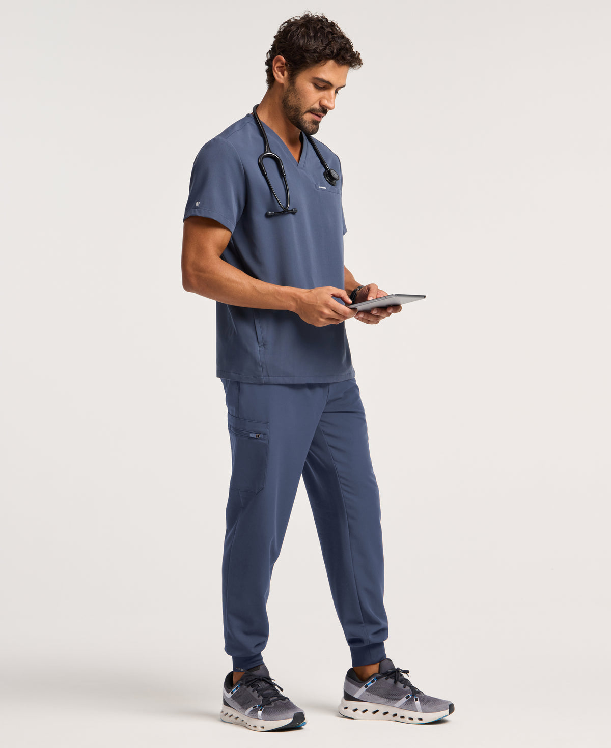 Jaanuu Platt 3-Pocket Scrub Top in Carbon Gray, product photo 3 of 6