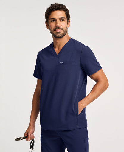 Jaanuu Platt 3-Pocket Scrub Top in Midnight Navy, product photo 1 of 6