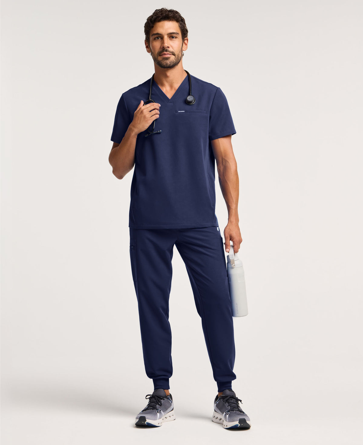 Jaanuu Platt 3-Pocket Scrub Top in Midnight Navy, product photo 2 of 6