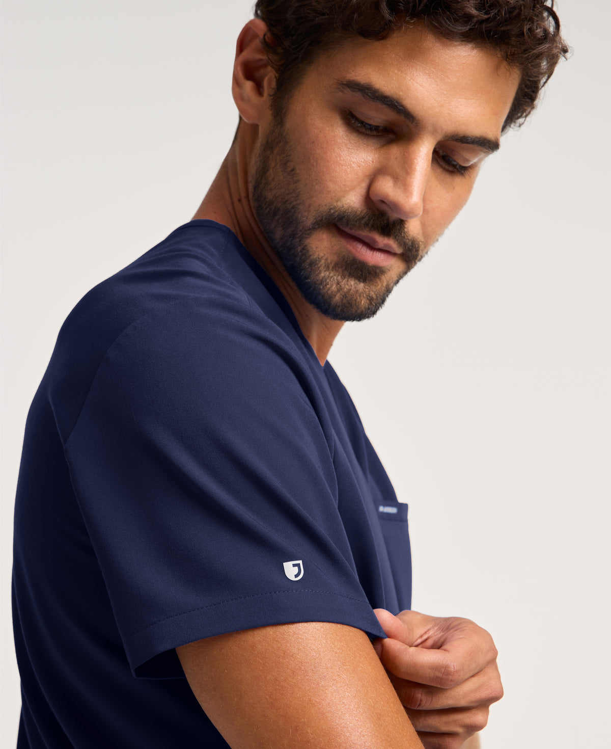 Jaanuu Platt 3-Pocket Scrub Top in Midnight Navy, product photo 4 of 6