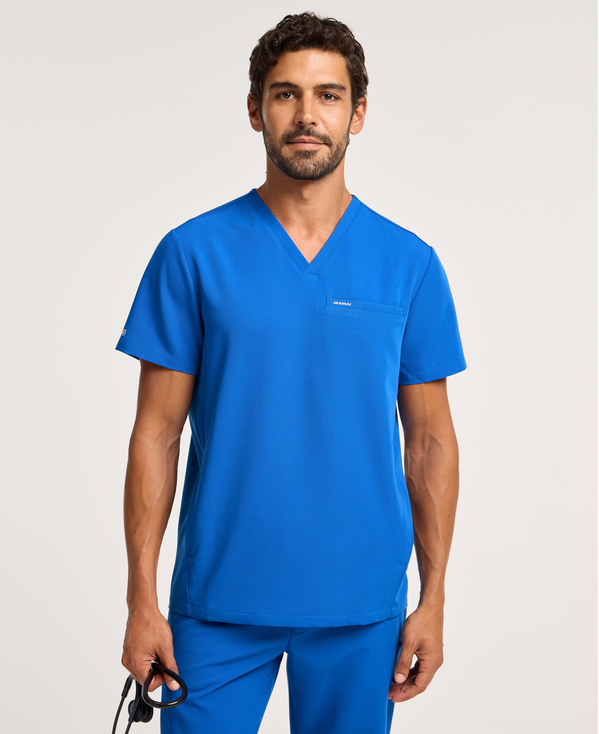 Jaanuu Platt 3-Pocket Scrub Top in Royal Blue, product photo 1 of 6