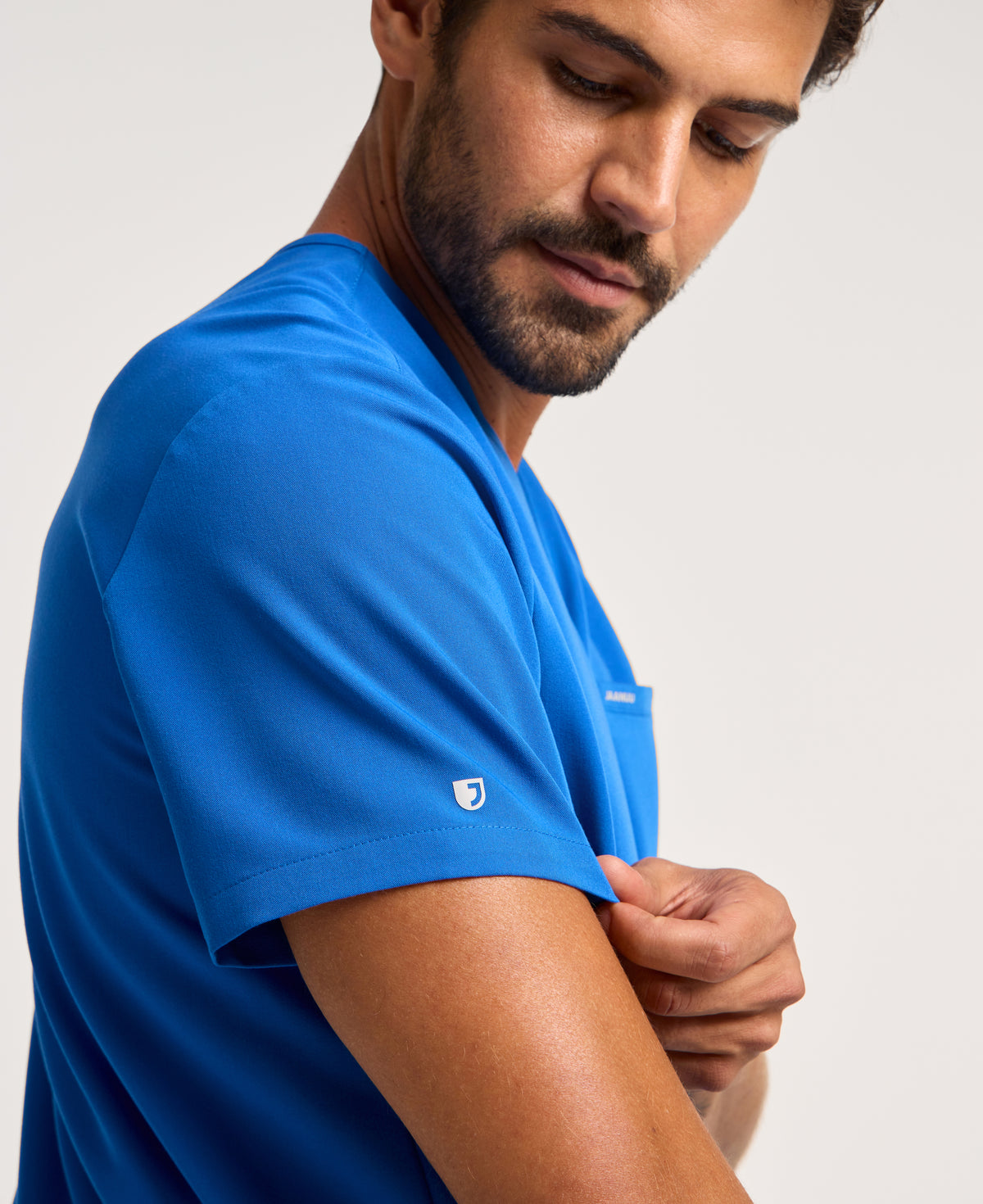Jaanuu Platt 3-Pocket Scrub Top in Royal Blue, product photo 3 of 6