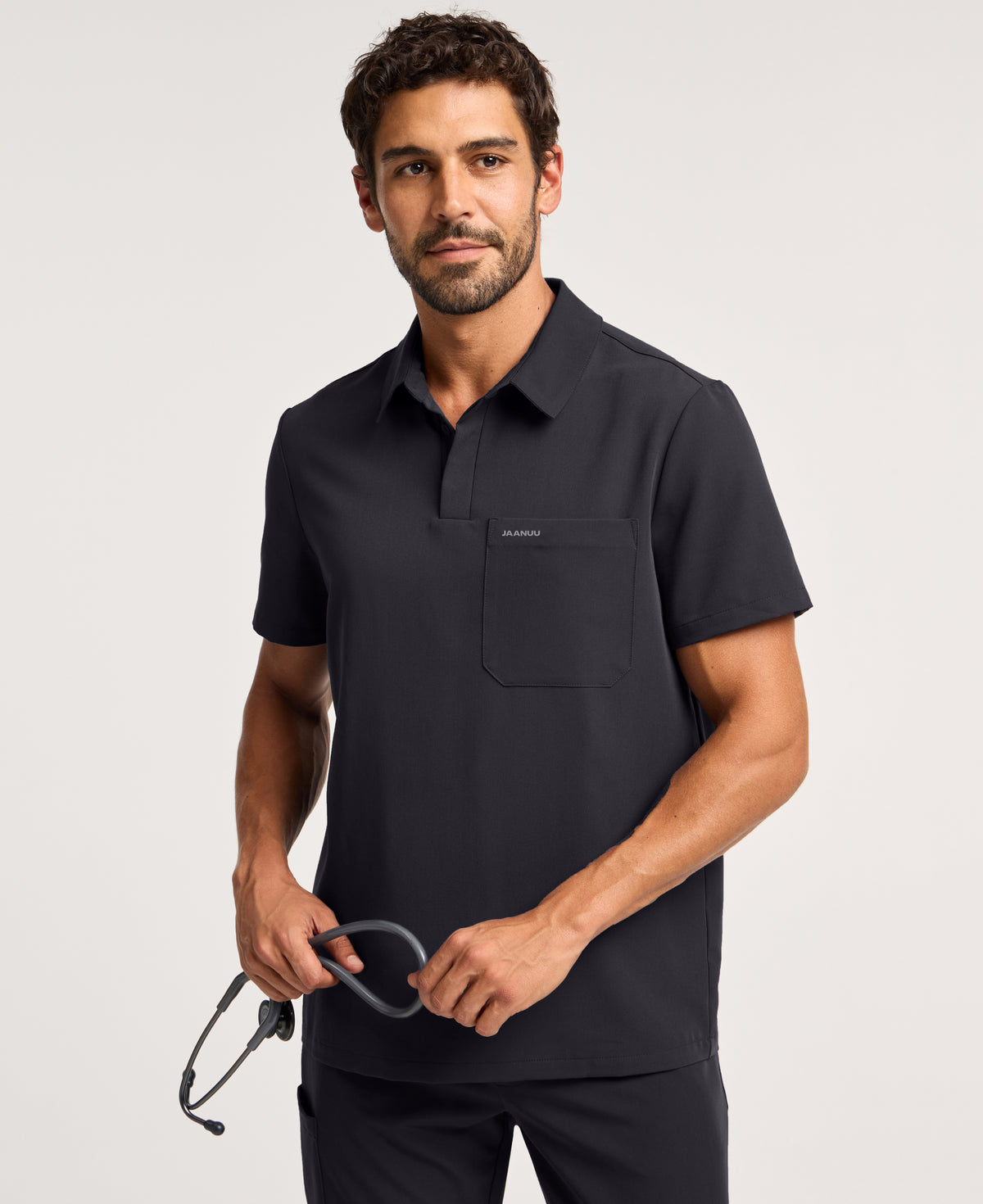 Jaanuu Calderon Polo Scrub Top in Black, product photo 1 of 6