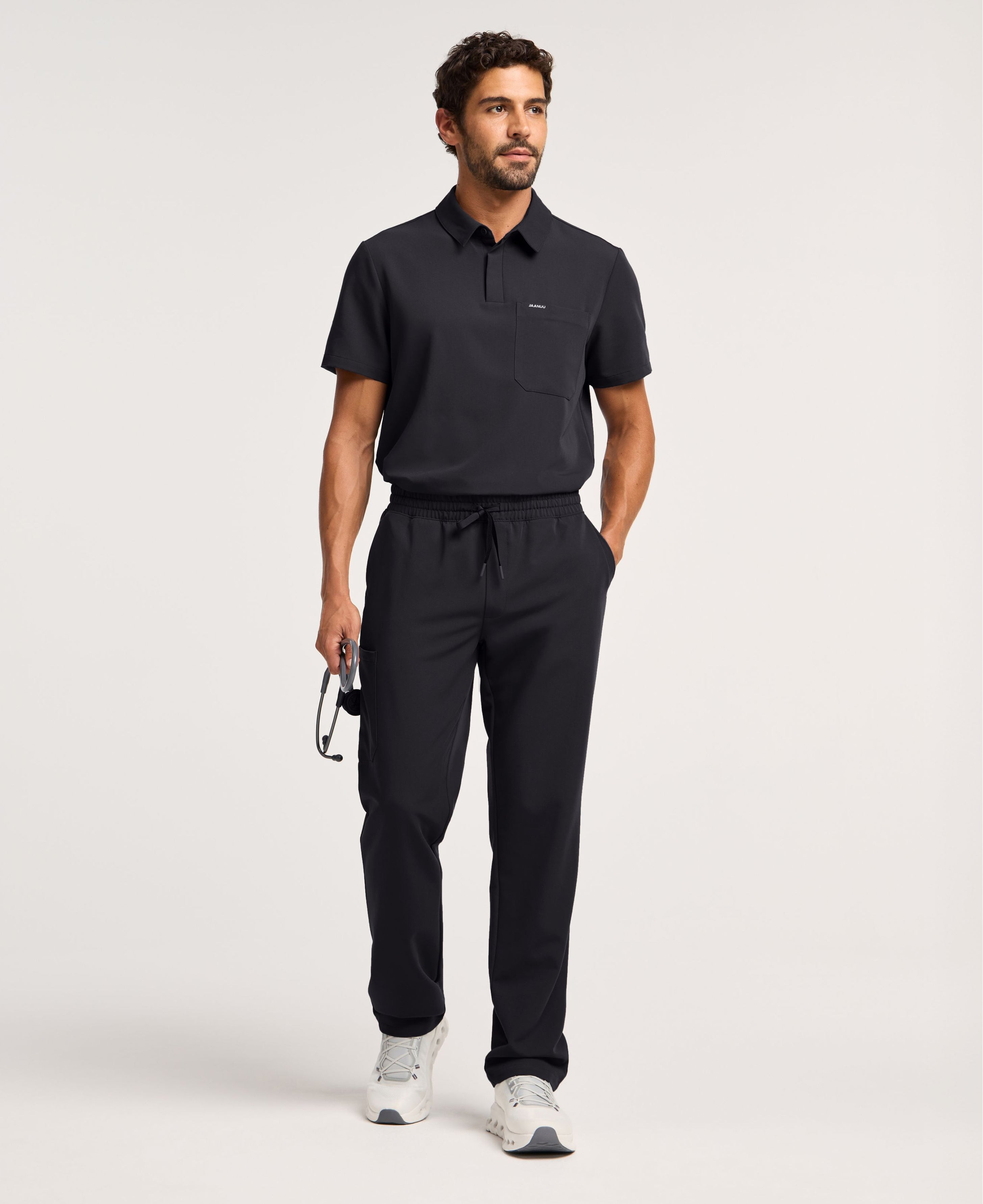 Jaanuu Calderon Polo Scrub Top in Black, product photo 2 of 6