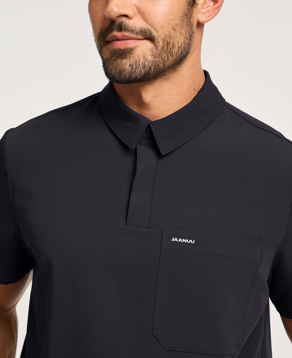 Jaanuu Calderon Polo Scrub Top in Black, product photo 3 of 6
