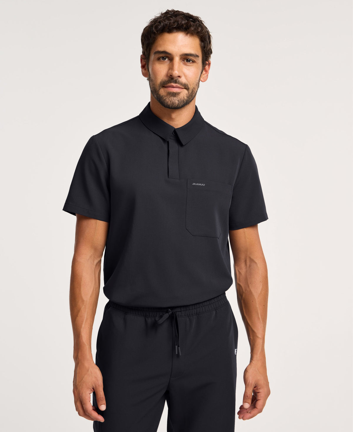 Jaanuu Calderon Polo Scrub Top in Black, product photo 4 of 6